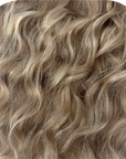 Wavy rooted dark blonde mix Couture Hair Co. hair extensions in both k-tip and micro weft